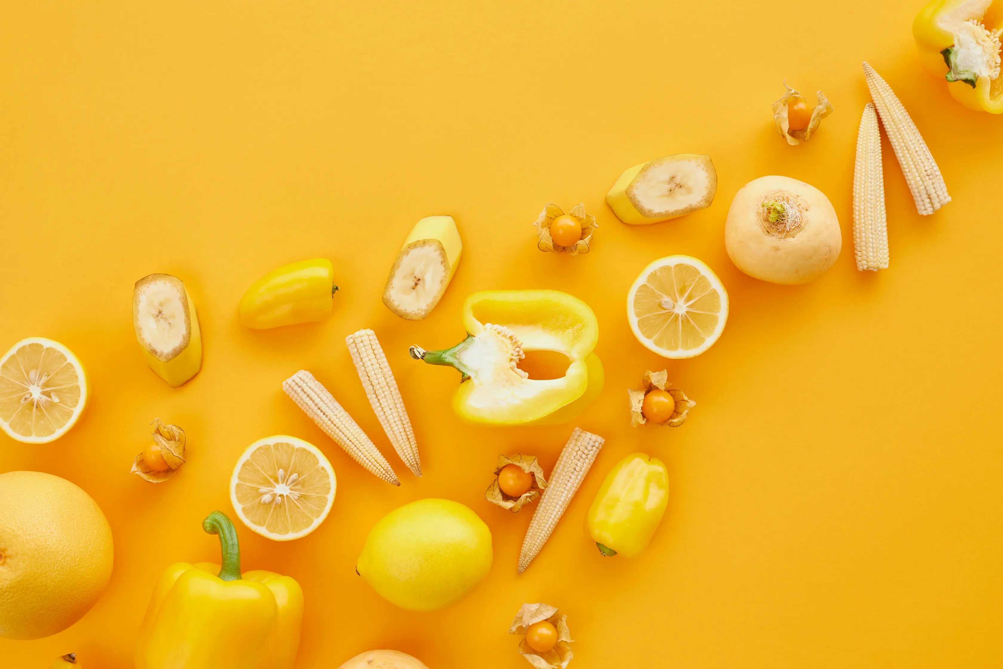 Fresh yellow vegetables and fruit