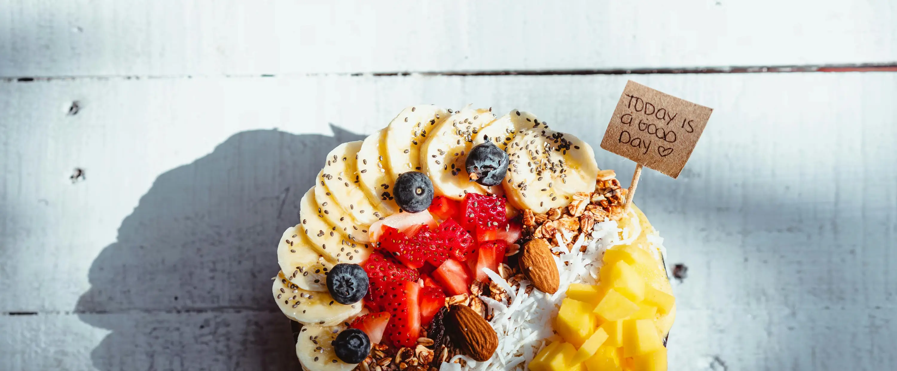 Breakfast bowl with banana, strawberries and granola